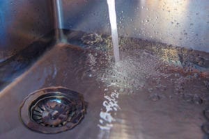 Having drain cleaning done in your home by a plumber